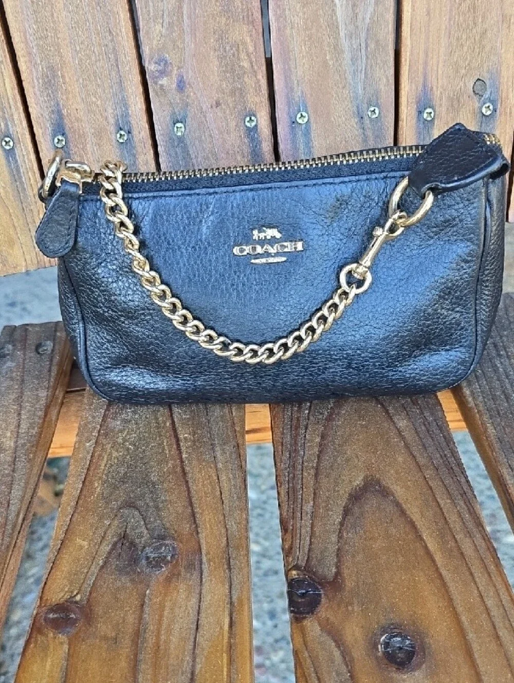Coach Black Leather Mini Wristlet with Gold Chain 8' L x 5' H.